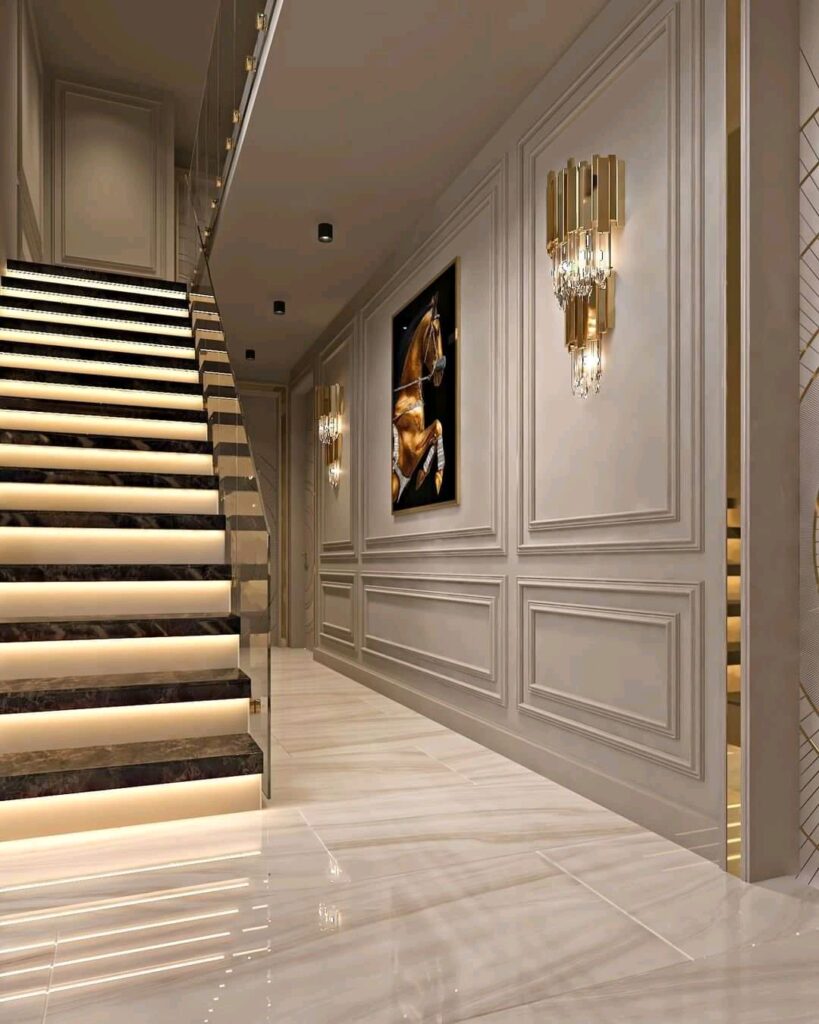 Luxury hallway and staircase interior design with LED tread lighting and Vastu compliant main entrance decor
