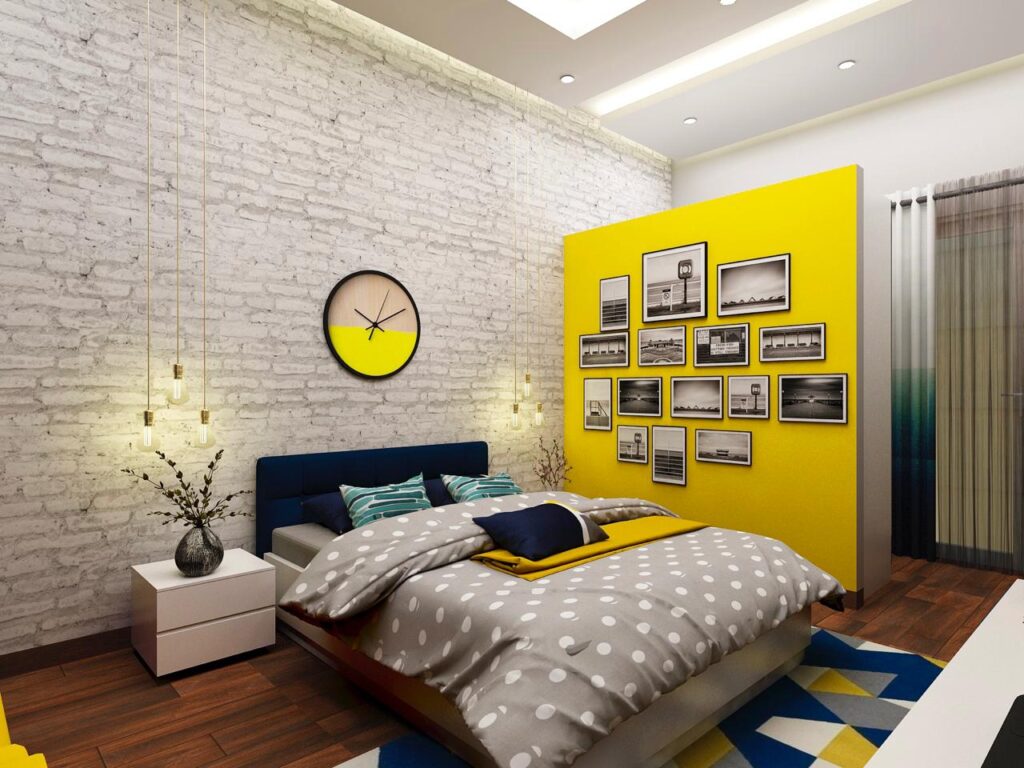 Modern bedroom interior design with exposed white brick wall, yellow partition accent wall, photo gallery frame collage, and hanging pendant lights
