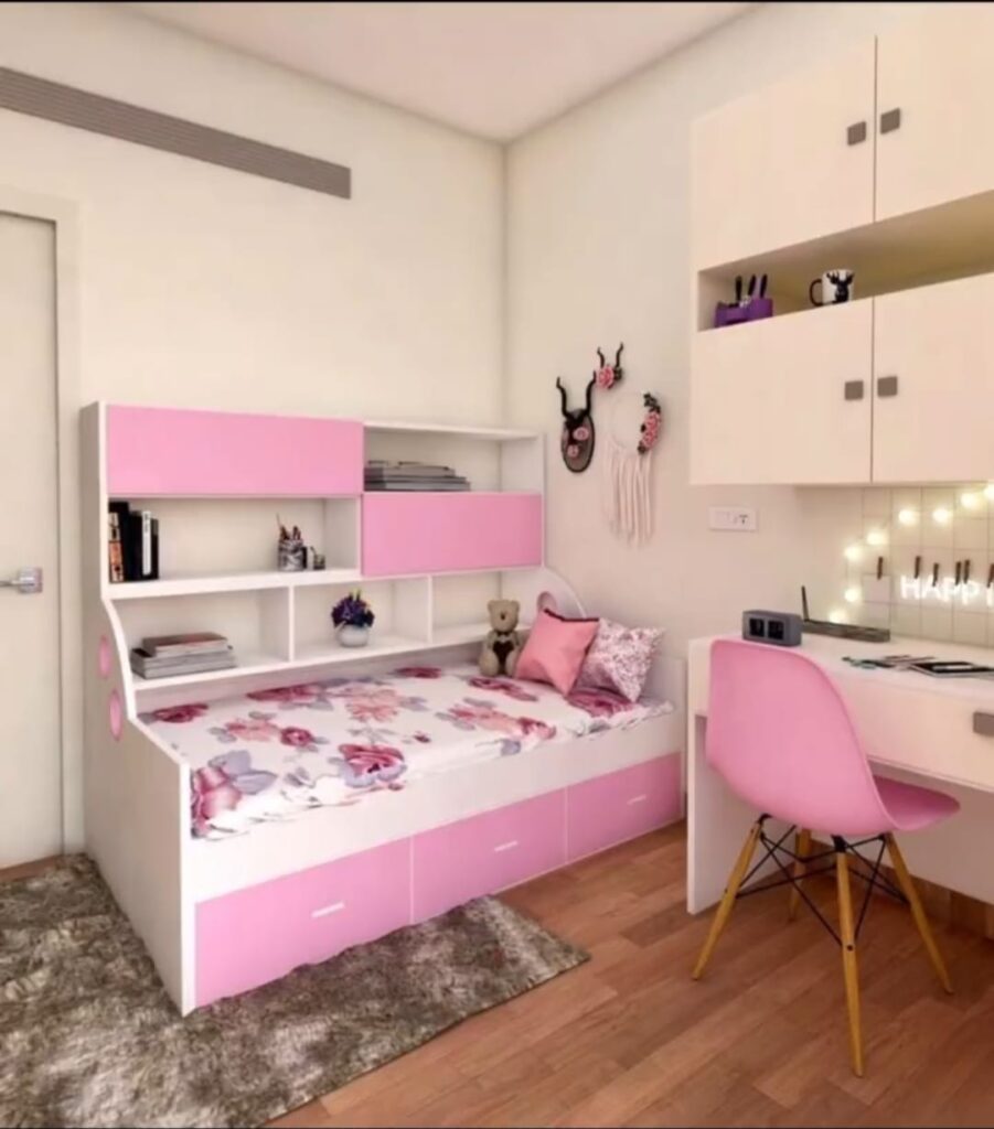 Modern kids pink and white bedroom interior design with space-saving trundle bed, built-in bookshelf, and study desk with chair